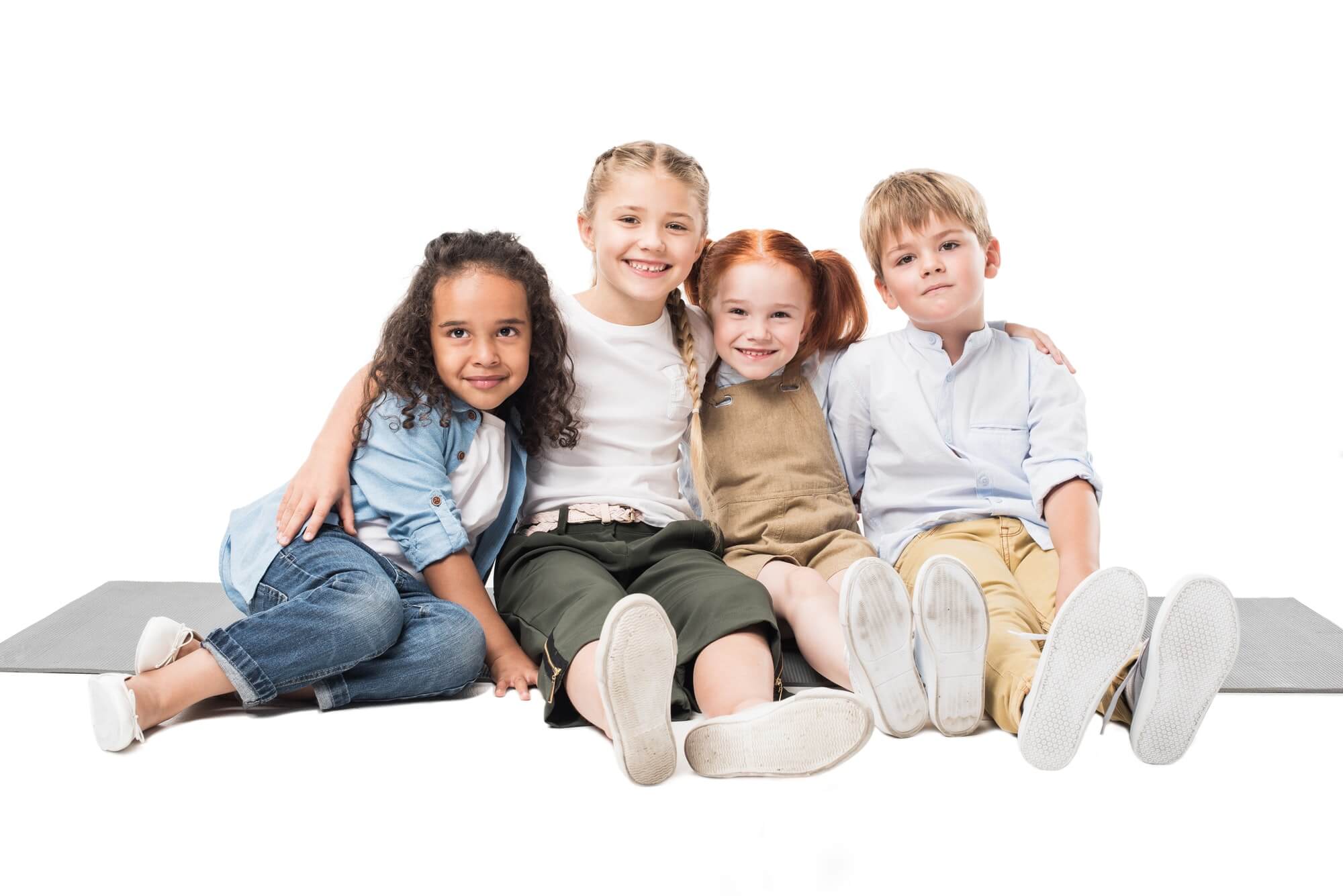 happy-multiethnic-children-sitting-together-isolated-on-white.jpg